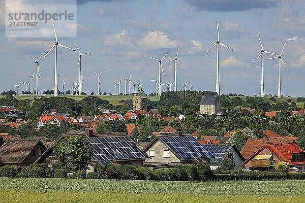 Lichtenau  North Rhine-Westphalia  Germany  wind farm in the village of Lichtenau. The wind farm is an important showcase project for climate protection in East Westphalia and for the energy town of Lichtenau. In front  residential buildings with solar panels on the roof  Europe