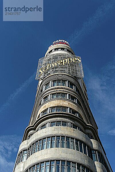 Madrid  Spain  November 1  2020: Carrion Building in the Square of Callao and Gran Via of Madrid. Low angle view against bright blue sky  Europe