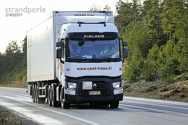 Driving white Renault Trucks T of Cemt-Trans Oy in front of Thermo King refrigerated trailer along highway 25 in Hanko  Finland. February 14  2020