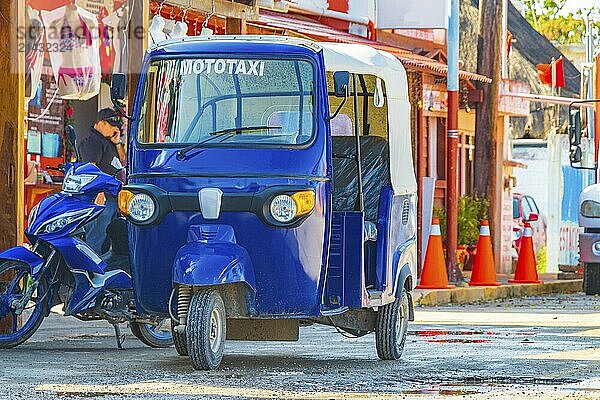 Blue auto rickshaw tuk tuk in beautiful Chiquilá village port harbor Puerto de Chiquilá in Quintana Roo Mexico