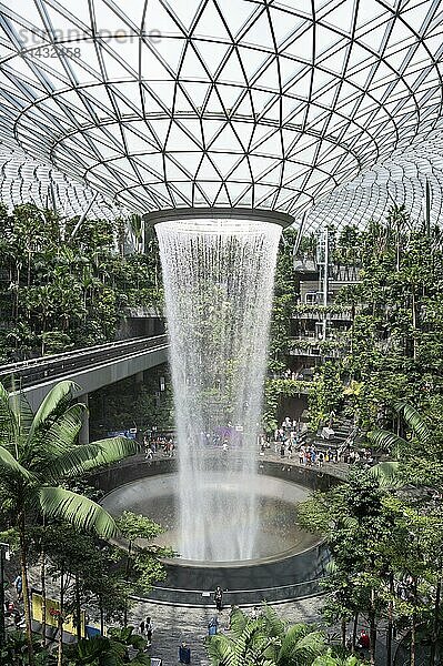 31.07.2023  Singapore  Republic of Singapore  Asia  Shiseido Forest Valley indoor garden with the rain vortex of the Rain Vortex indoor waterfall at the centre of the modern Jewel Terminal at Singapore Changi Airport. Jewel Changi is a nature-themed entertainment and retail complex surrounded by and connected to Changi Airport's T1  T2 and T3 passenger terminals  Asia