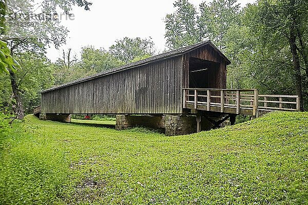 Meadville  Missouri - The Locust Creek Covered Bridge  a state historic site. The bridge was built in 1868. It carried vehicles on Missouri Route 8  a main east-west road  in the early 20th century. The channel of Linn Creek moved after 1945.