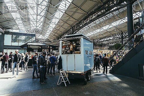 London  UK  May 14  2019: Old Spitalfields market with unidentified people. Street food stalls. The market hosts arts and craft and street food market