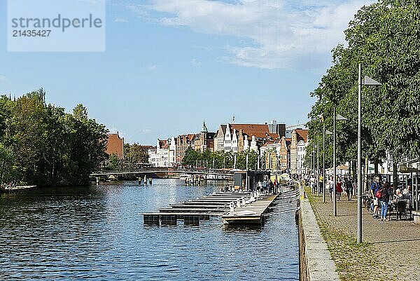 Lubeck  Germany  August 3  2019: Scenic view of Trave River and waterfront in the old harbour  Europe