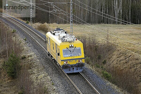 Finnish State Railways Ttr1 51 EMMA  Plasser & Theurer EM-120  track inspection vehicle at speed on Coastal Railway. Salo  Finland. November 27  2020