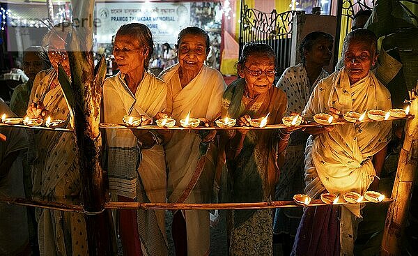 Elderly women of Pramod Talukdar Memorial Old Age Home light Diya oil lamps as they celebrate Diwali  in Guwahati  India on 1 November 2024. Diwali  also known as the Festival of Lights  is one of the most widely celebrated Hindu festivals  symbolizing the victory of light over darkness and good over evil