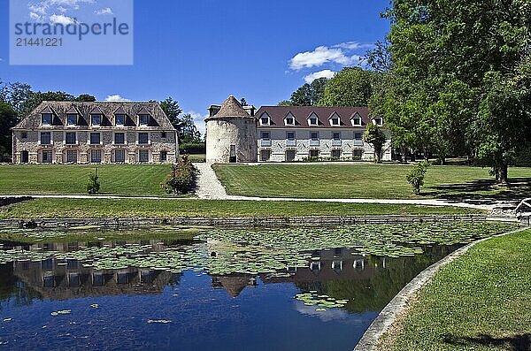 Fragment of an old French castle park on a bright summer day