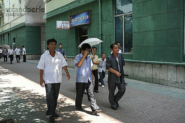 08.08.2012  Pyongyang  North Korea  Asia  North Koreans walk along a street in the centre of the capital Pyongyang  Asia