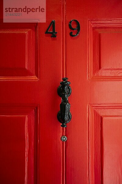 Close-up of a red door with the number 49 and a black door knocker  Charles Dickens Museum  48-49 Doughty Street  Holborn  London Borough of Camden  England  United Kingdom  Europe