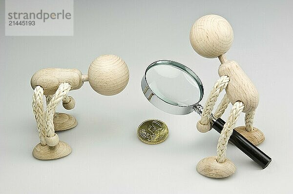 Two wooden figures with magnifying glass and 50 euro cent coin  Federal Republic of Germany