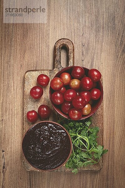 Tkemali sauce  from red cherry plum  Georgian tkemali sauce  top view  no people