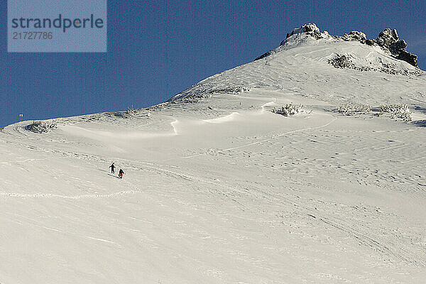 A skiers and snowboarder hiking in the Kirkwood Backcountry. Kirkwood Ski Resort  Kirkwood  California.