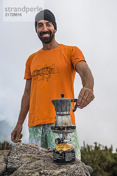 Having a coffee on top of Pico da Caledônia in Três Picos State Park  Rio de Janeiro  Brazil