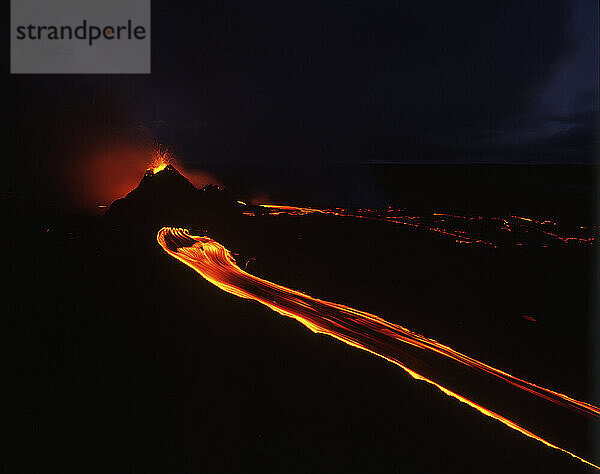 Lava stream from Pu'u O'o vent eruption moving in fluid motion at night