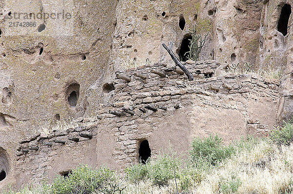 Main Loop trail in Frijoles Canyon at Bandelier National Monument  New Mexico. Showing the archeological features left by the Ancestral Pueblo People (Anasazi). reconstructed Talus House.