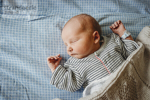 Newborn baby boy sleeping peacefully at hospital