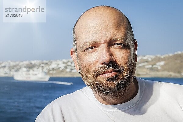 An image of a handsome middle age man with a beard