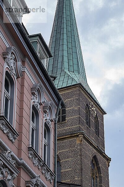 Church tower with sky and clouds in the city