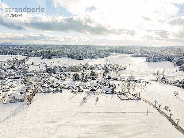 Aerial view of a snow-covered village with extensive fields and forests  Oberreichenbach  Black Forest  Calw district  Germany  Europe