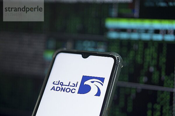 Abu Dhabi National Oil Company (ADNOC) on smartphone.