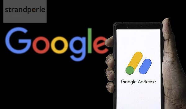 Smart phone with the Google Ads logo is a service and program of the company Google