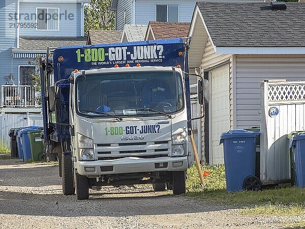 Calgary  Alberta  Canada. Aug 2  2024. A white GOT JUNK truck parked on a residential street  ready to collect junk. The truck has the company logo and phone number on its side