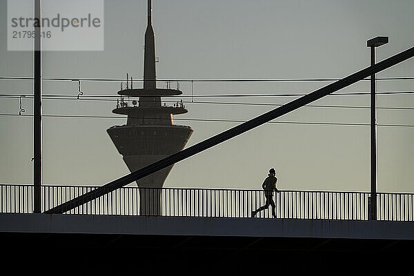 Jogger on the Oberkassler Rhine Bridge  Rhine Tower  Düsseldorf  North Rhine-Westphalia  Germany  Europe