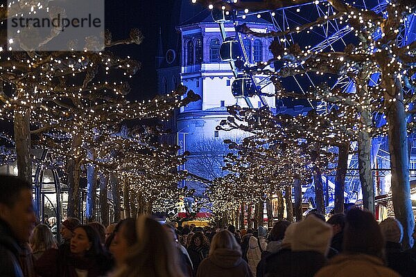 Christmas market and castle tower on the Rhine promenade in Düsseldorf  North Rhine-Westphalia  Germany  29 November 2024  Europe