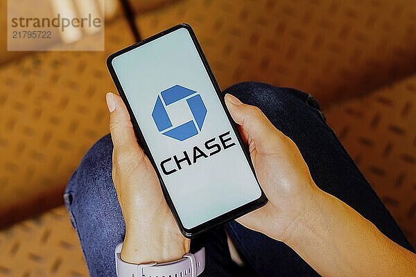 In this photo illustration  the Chase Bank logo is displayed on a smartphone screen