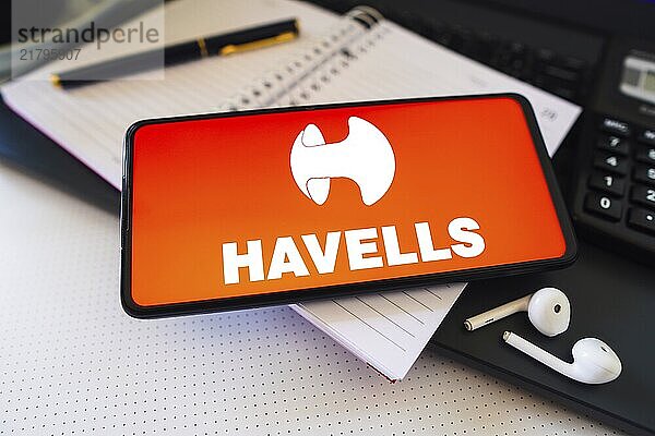 In this photo illustration  the Havells India Limited logo is displayed on a smartphone screen