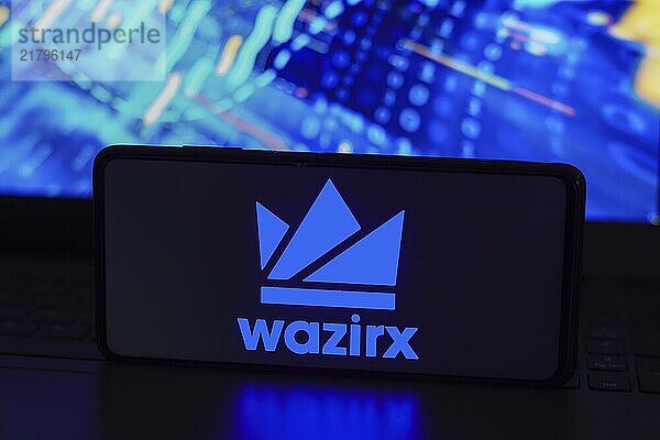 In this photo illustration  the WazirX logo seen displayed on a smartphone