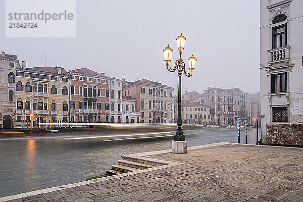 Foggy view of Canal Grande with Vaporetto in Venice  Italy