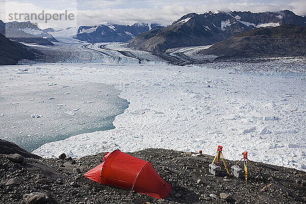 A glaciologist relaxes at a remote camp overlooking the Columbia Glacier  near Valdez  Alaska.