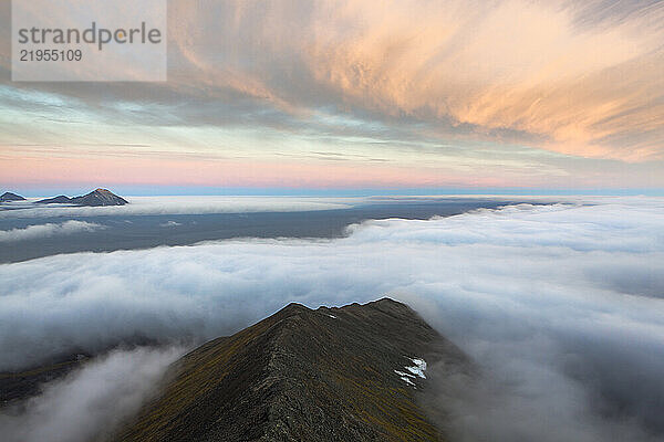 Low clouds approach the coast from the Greenland Sea  seen from high on Ariekammen  Hornsund  Svalbard.