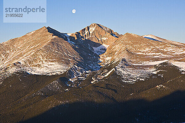 Moon over Longs Peak at sunrise  Rocky Mountain National Park  Colorado.